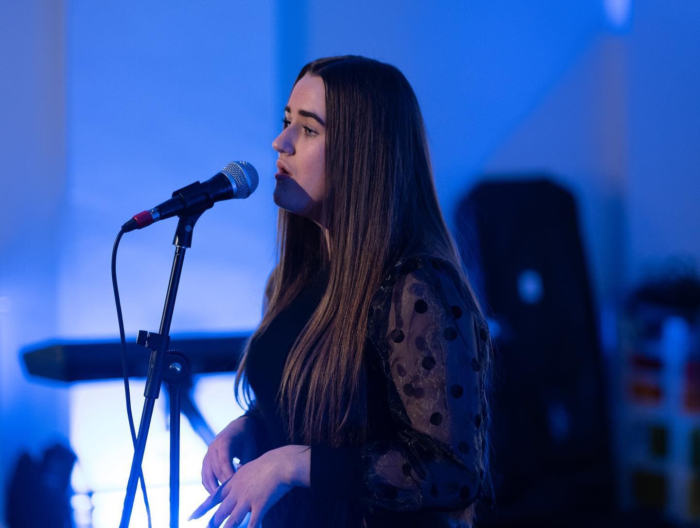 Young person singing at Providence House Youth Club